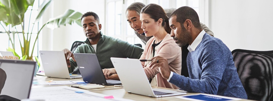 Top-down view of four people working